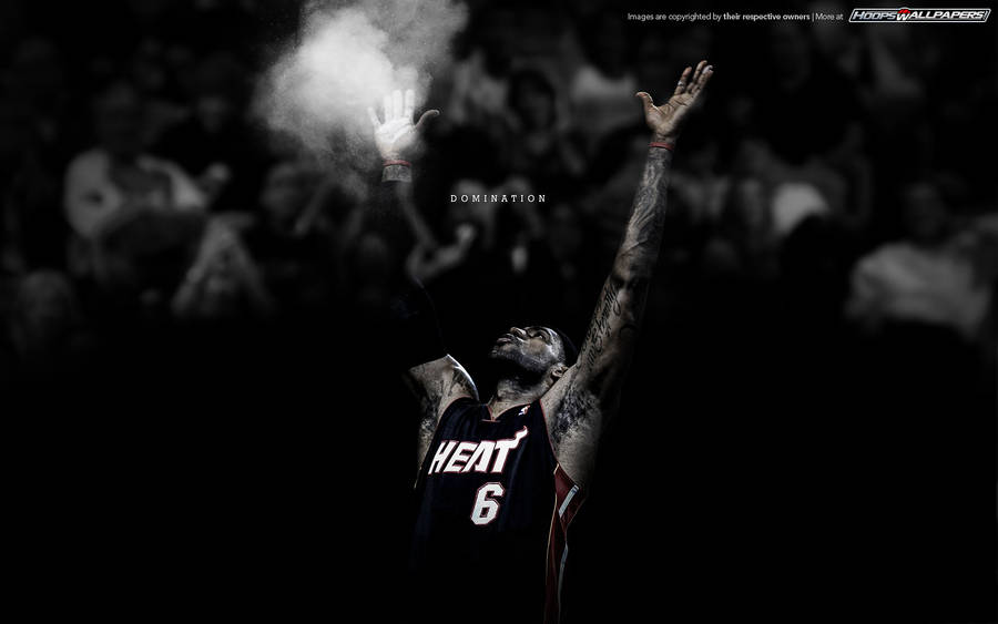 Lebron James with arms raised for NBA domination wallpaper