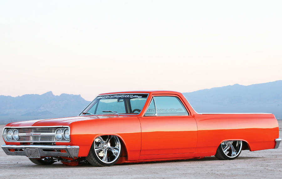 Download Lowrider Chevrolet El Camino Orange Wallpaper | Wallpapers.com