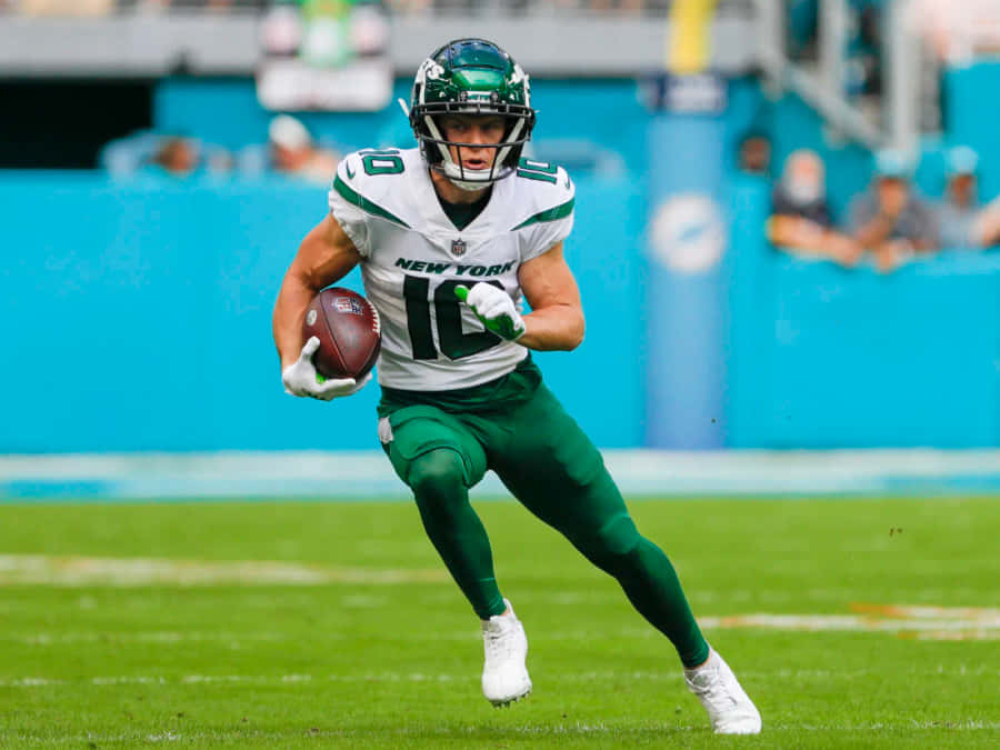 Jogador dos New York Jets Correndo com a Bola
