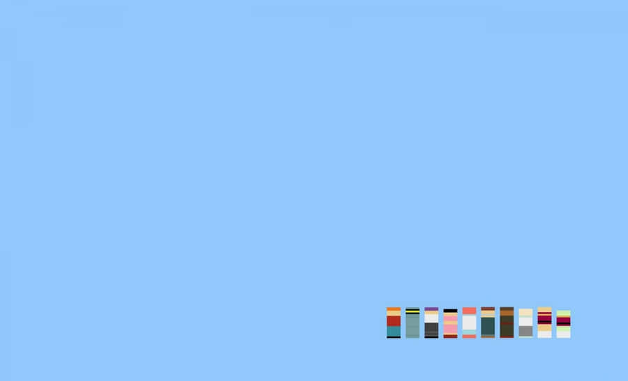 Minimalistisches Macbook-Setup auf blauem Hintergrund