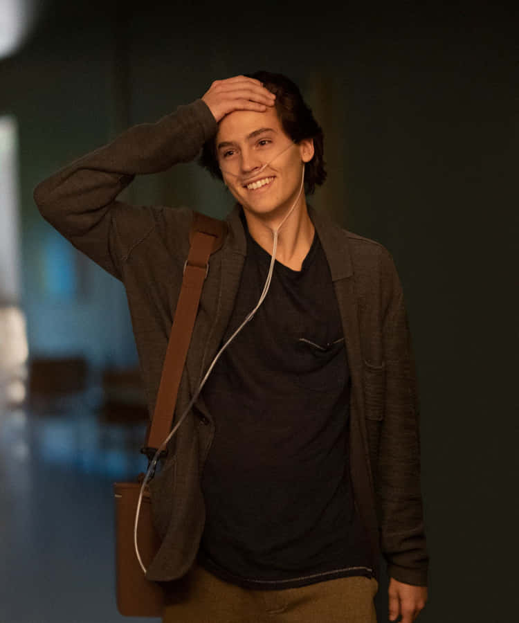 colesprouse is a famous actor known for his roles in television shows and movies. He gained widespread recognition for his portrayal of Jughead Jones in the television series Riverdale. Cole's talent and good looks have made him a popular choice for computer and mobile wallpapers. Many fans love to admire his handsome face and stylish outfits by setting his pictures as their wallpaper. Whether it's a casual snapshot or a glamorous photoshoot, cole sprouse's images add a touch of charm and allure to any device screen. So, if you're a fan of cole sprouse, consider setting his pictures as your computer or mobile wallpaper to show your support and admiration!