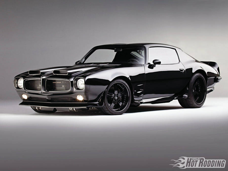 Pontiac Firebird Muscle Car är en utmärkt bakgrundsbild för datorn eller mobilen. Bilens kraftfulla prestanda och klassiska design kommer att imponera på alla bilentusiaster. Skapa en unik och imponerande look med Pontiac Firebird Muscle Car som bakgrundsbild.