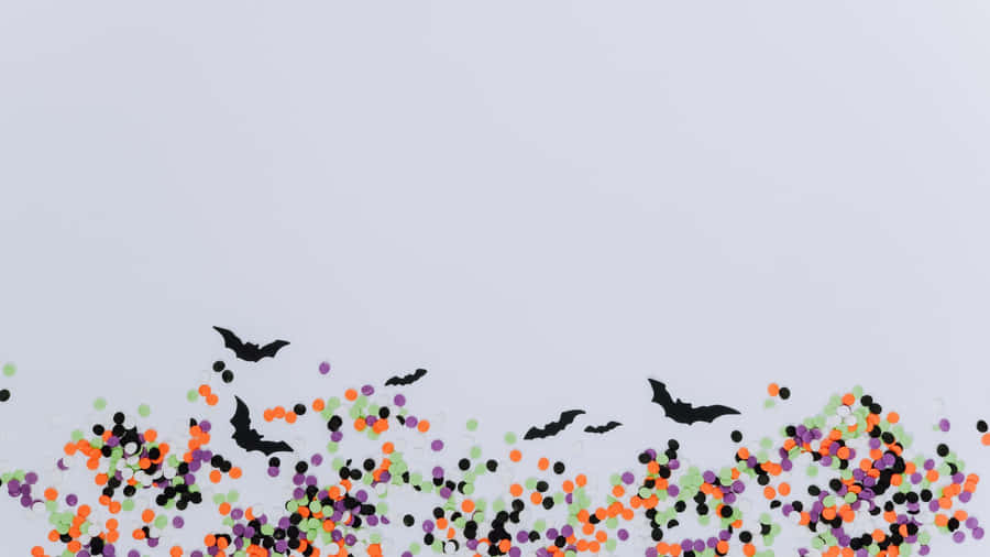 Fundo de Halloween com Confete e Morcegos