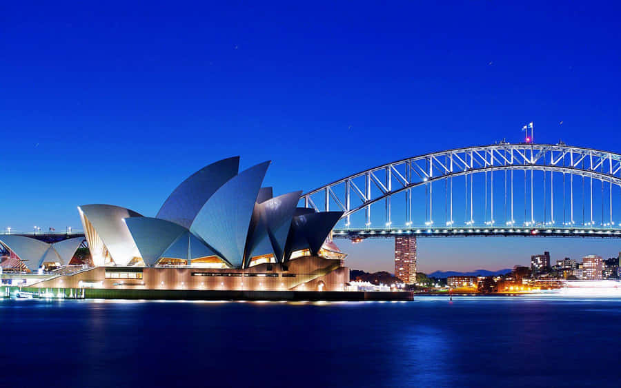 Sydney Opernhaus und Hafenbrücke bei Dämmerung.jpg