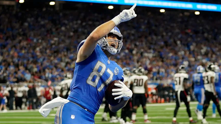 Fodboldspiller fejrer touchdown