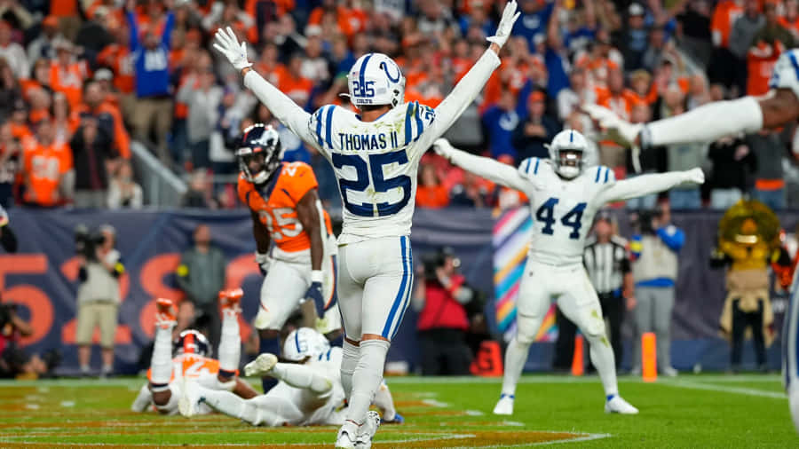 Celebração dos Colts no Jogo de Futebol