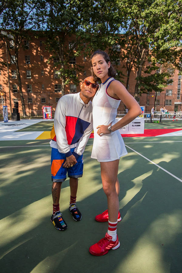 Garbine Muguruza With Pharrell Williams