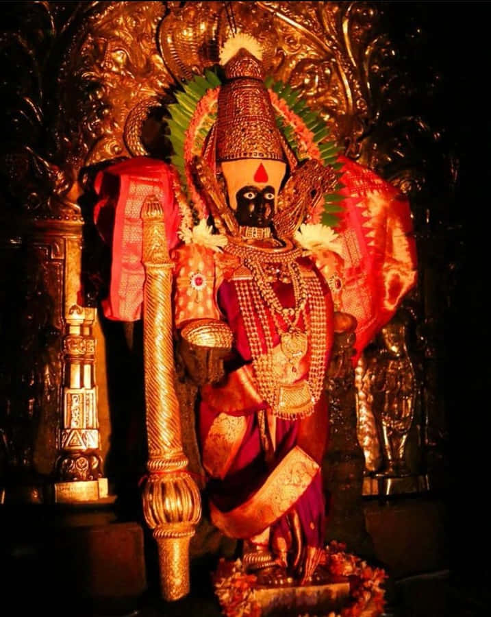 Utsmykket Mahalakshmi Idol Gullbakgrunn