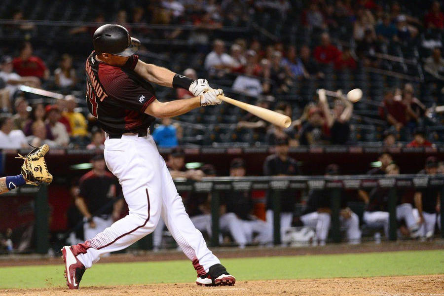 Download Paul Goldschmidt Swinging Baseball Bat Wallpaper | Wallpapers.com