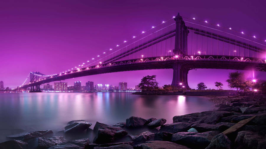 Purple aesthetic lit bridge in New York City wallpaper.
