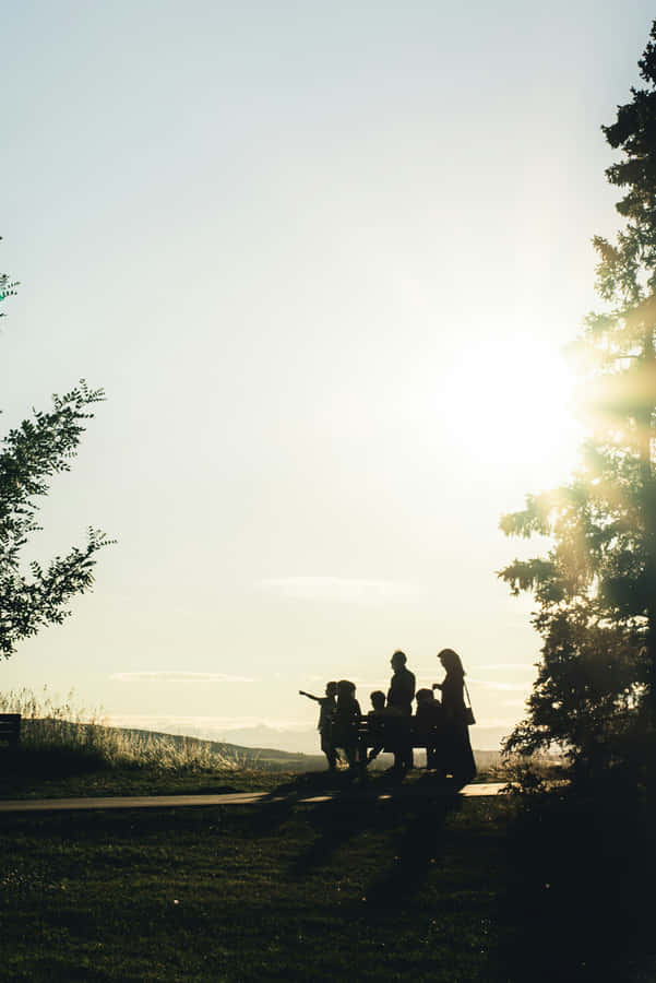 Familien-Sonnenuntergang Silhouette Park