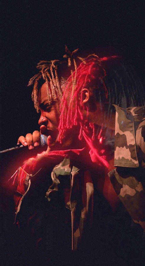 Juice Wrld with bright red lights wallpaper.