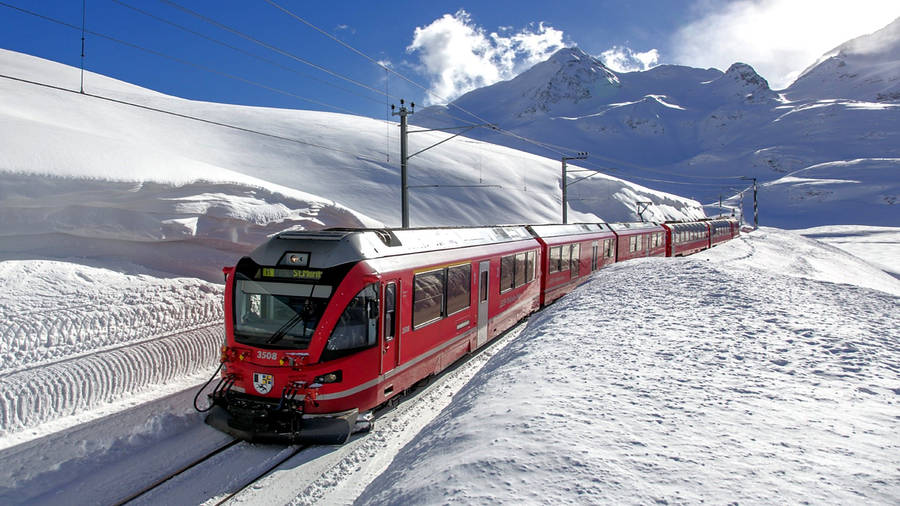 Download Red Train In Switzerland Wallpaper | Wallpapers.com