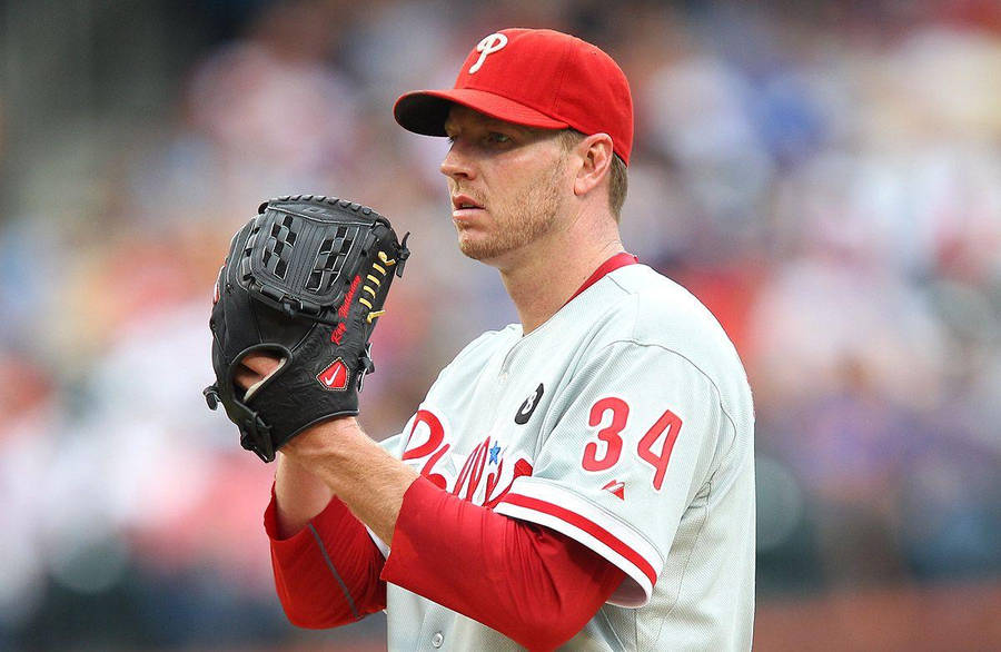 Download Roy Halladay Adjusting Baseball Glove Wallpaper | Wallpapers.com