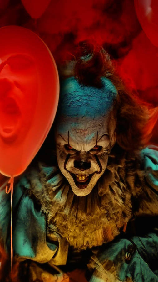 Download Smiling Pennywise With Balloon Wallpaper | Wallpapers.com