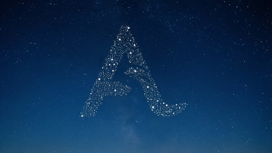A peaceful night sky wallpaper with stars arranged in the JavaScript logo.