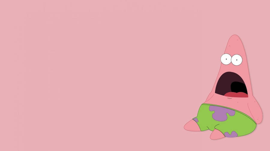 Patrick the starfish sitting lazily on a pink background with his mouth wide open.