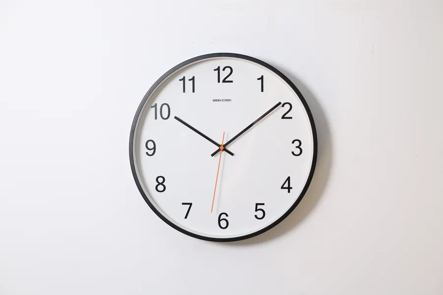 Clock with red pointer wallpaper