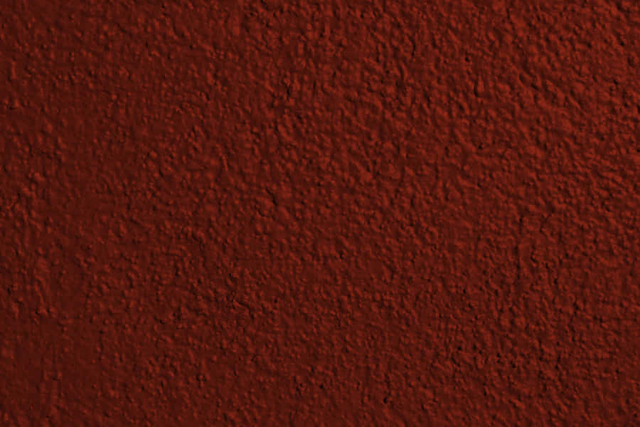 RoteTexturwand mit dunklem rotem Farbanstrich Bild