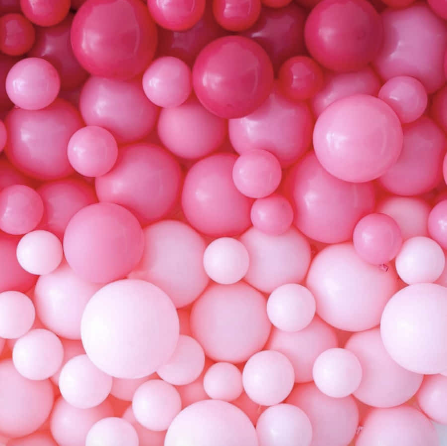 Fejrmed disse sjove lyserøde balloner.