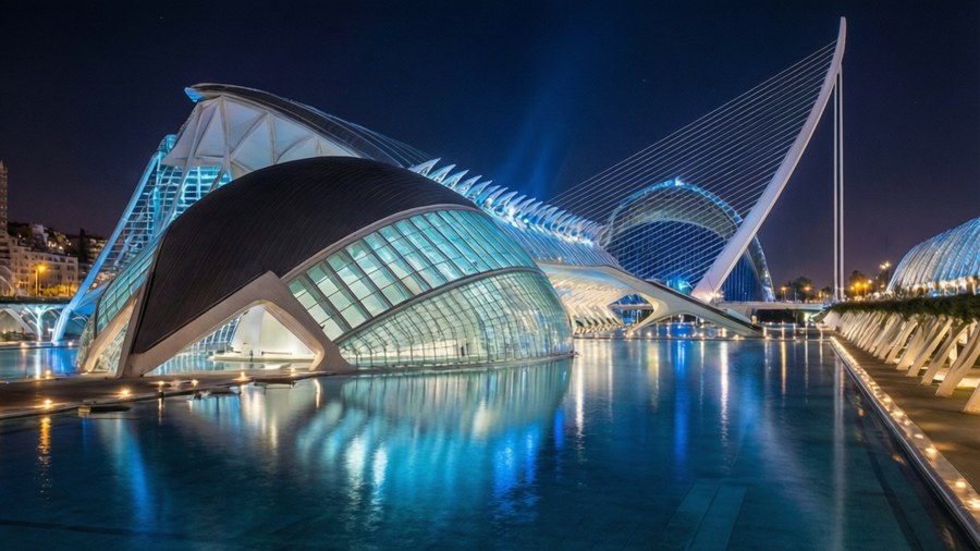 Futuristic architectural complex glowing at night with reflections.