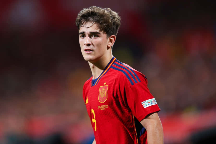 Calciatore Spagnolo in Maglia Rossa