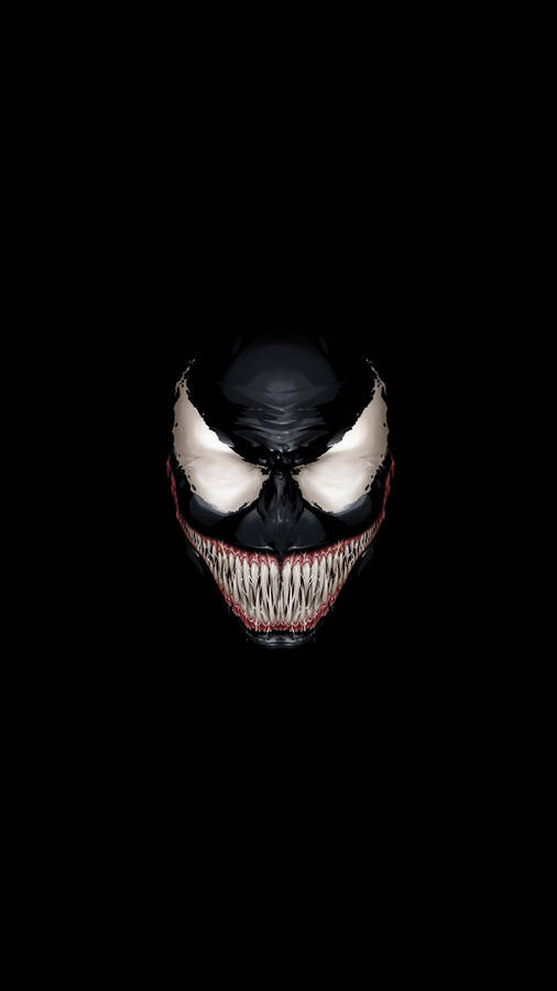 Alien symbiote Venom merging with the black background wallpaper.