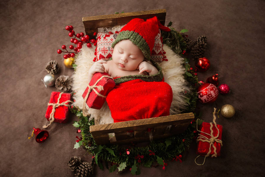 Download Very Cute Baby In Christmas Outfit Wallpaper | Wallpapers.com