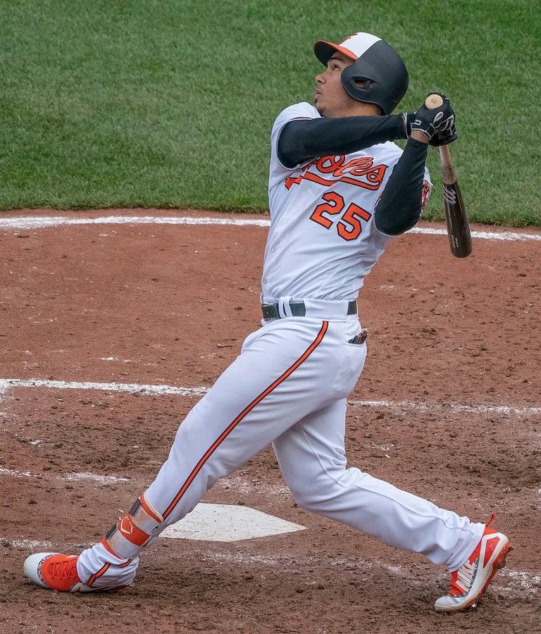 Baseball Player Swinging Bat