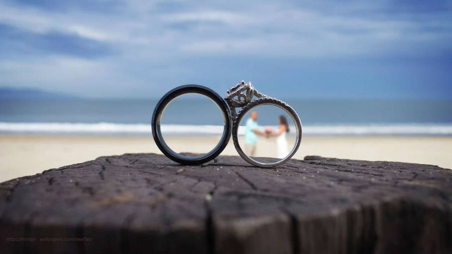 Download Wedding Rings On The Beach Wallpaper | Wallpapers.com