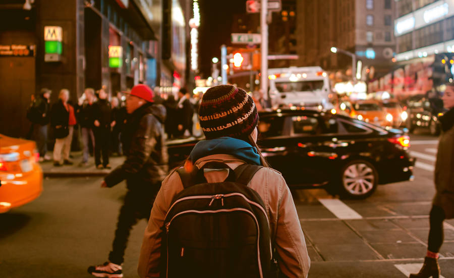 Download Woman Enjoying New York City Night View Wallpaper | Wallpapers.com