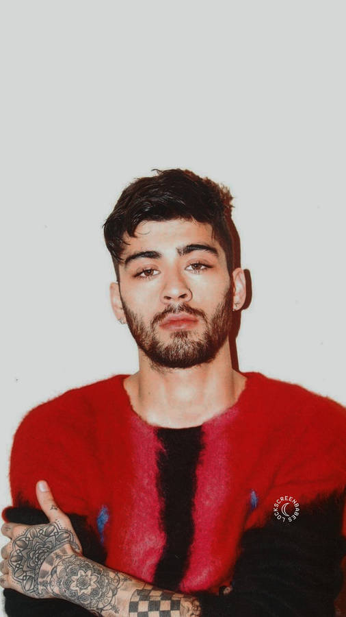 Download Zayn Iphone In Cool Red Tee Wallpaper | Wallpapers.com