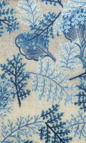 Blue botanical pattern on beige textured fabric for wallpaper.