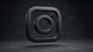 A realistic 3D black Instagram logo with shadows and highlights on a dark background. — Black Instagram Wallpaper