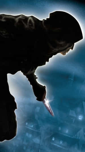 Silhouetted hooded figure holding a knife over a glowing blue cityscape.