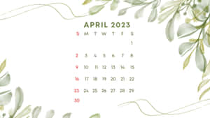 April 2023 calendar with green watercolor leaf accents on white background. — April Background