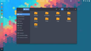 Desktop mit buntem sechseckigem Tapet und geöffnetem Dateimanager-Fenster. — Linux Desktop Wallpaper