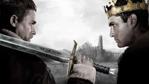 Two men in medieval armor face each other with swords drawn against a ruined castle backdrop. — Arthur Ashe Background