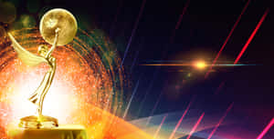 Gyllene Emmy-prisstaty med vingar som håller en glob mot en glödande kosmisk bakgrund. — Bästa Greedfall Bakgrund Bakgrunder