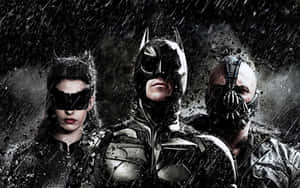 Batman Catwoman and Bane in a dark rainy scene with dramatic lighting.