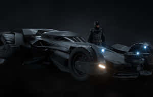 Batman stands beside his armored Batmobile in a dark misty environment with glowing lights. — 4K Batmobile Background