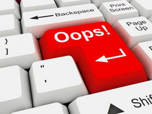 A red 'Oops!' key on a computer keyboard surrounded by white keys. — Hacker Logo Picture