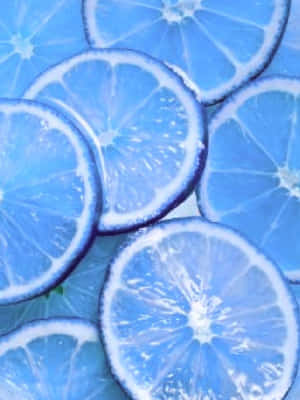 Blue-tinted citrus slices arranged in a vibrant abstract pattern. — Bluey Aesthetic Wallpaper