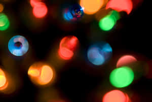 Colorful blurred lights glowing against a dark background. — Neon Lights Wallpaper