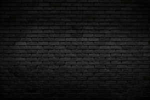 Parede de tijolos escura e texturizada com variações sutis de iluminação. — Textura de tijolo Papéis de Parede
