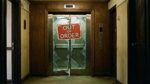 The iconic broken elevator door with the OUT OF ORDER sign.