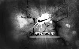 Nike-logo en slogan gespat op gebarsten betonnen muur. — Nike Graffiti Achtergronden