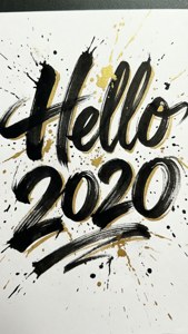 Artistic hand-lettered Hello 2020 wallpaper with ink splashes