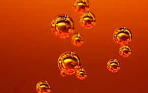 Floating amber bubbles glowing against a warm orange gradient background. — Landscape Wallpaper