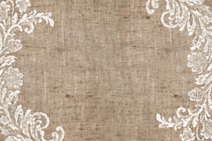 Beige burlap with white lace floral corner borders for elegant rustic design. — Treylon Burks Wallpaper